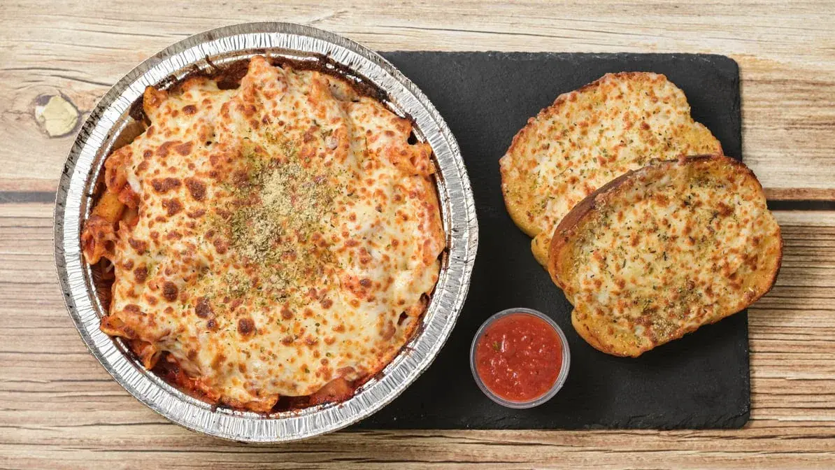 Fresh handmade pizza with house-made dough at Pizza 64 Winnipeg specialty pizzas